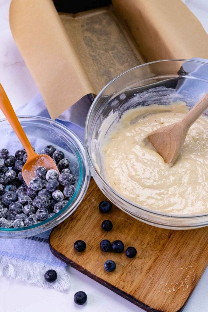 Blueberry bread dough with flour covered blueberries.
