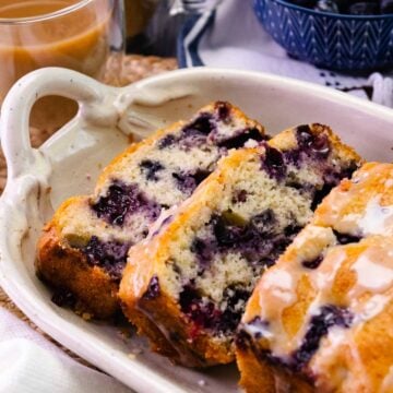 Homemade Blueberry Bread sliced served with coffee.