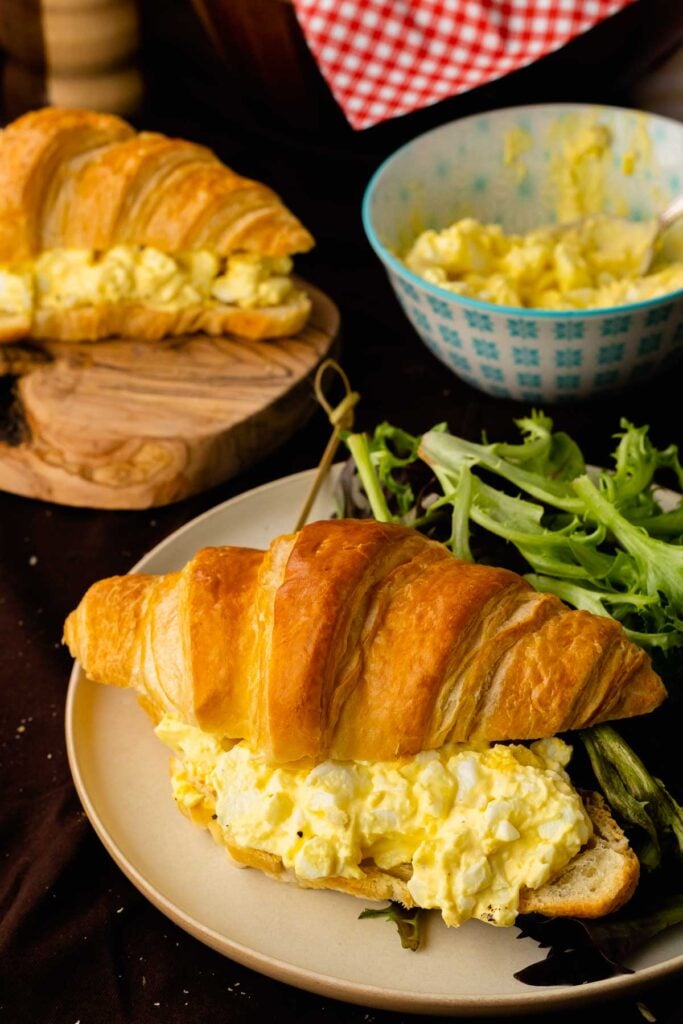 Egg Salad Sandwiches served with salad for lunch.