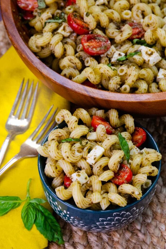 Two bowls of pesto pastsa sauce.