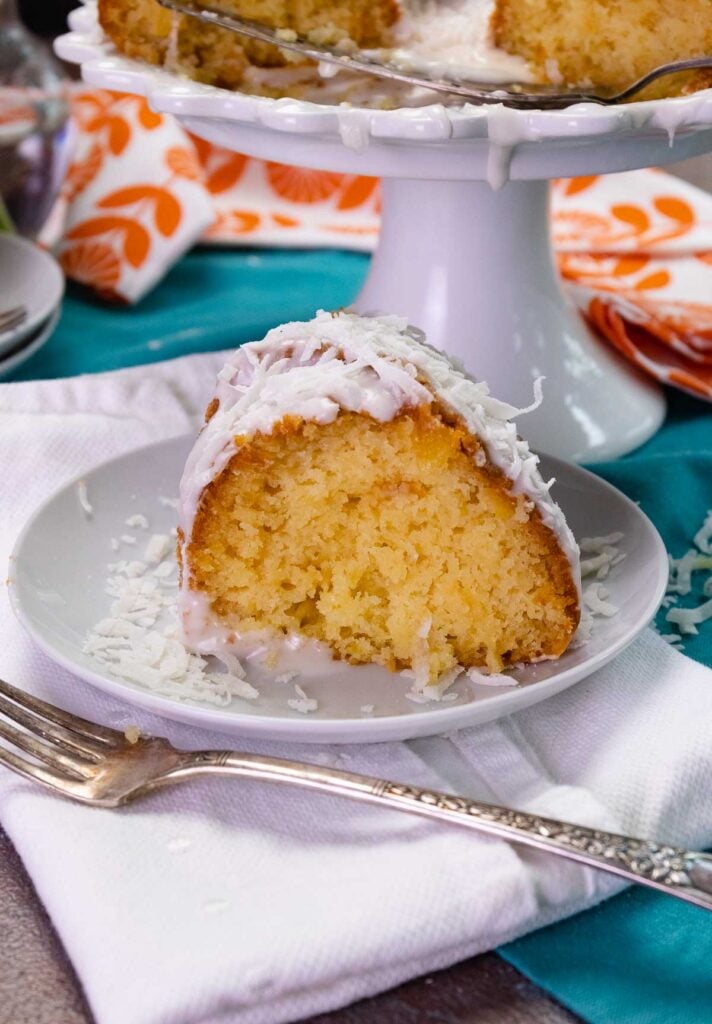One slice of deliciious Pina Colada Bundt Cake made with pineapple and coconut that starts with a boxed cake mix.