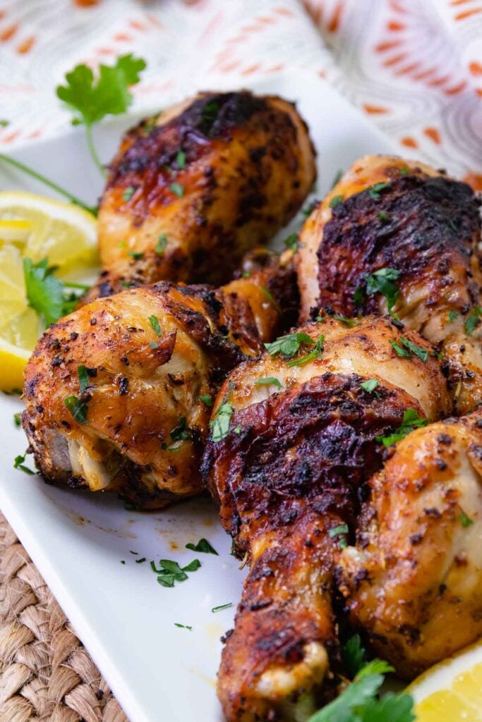 Air Fryer Chicken Legs (Drumsticks) are so delcious flavored with lemon pepper, paprika, garlic powder. Roasted to perfection in just 20 minutes, this is a great, inexpensive weeknight main dish and perfect for feeding a crowd.