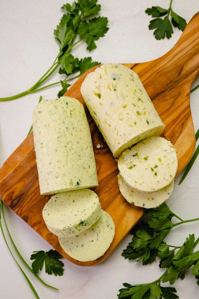 Slices of compound butter made with herbs, garlic, lime and jalapenos.