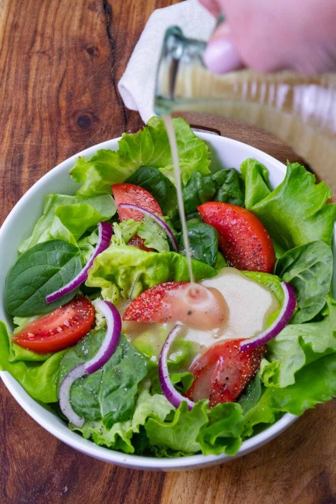 Everyday Green Salad is fresh, easy to make, with tomatoes, lettuce and onion. It's the best recipe that's simple and delicious.