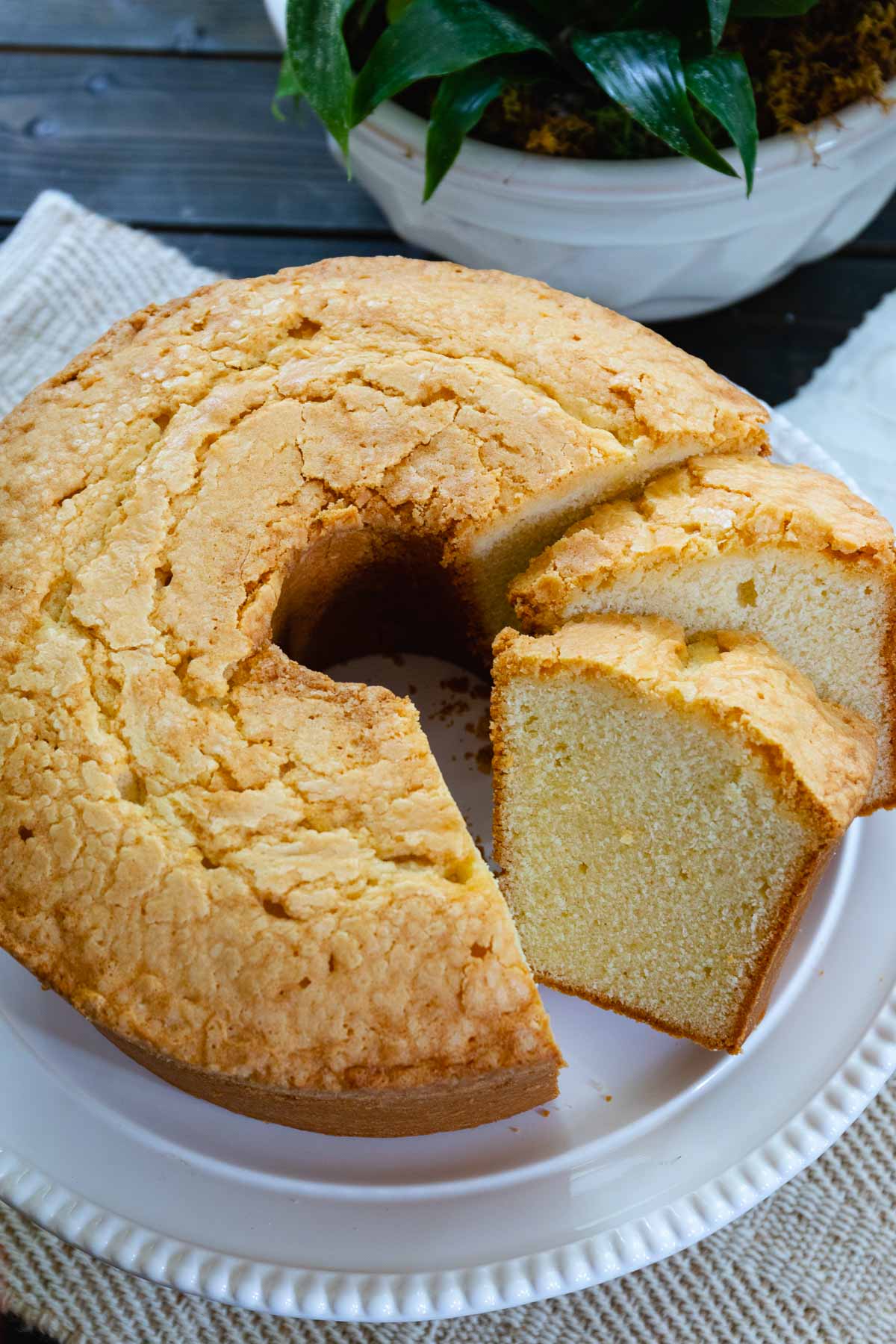 Sliced Million Dollar Pound Cake made with butter, eggs, sugar, flour and extracts served for dessert is delicious and easy to make.