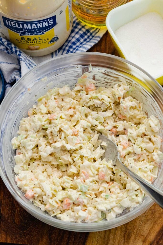 Creamy coleslaw for a side dish, hot dogs, hamburgers is great for serving at cookouts.
