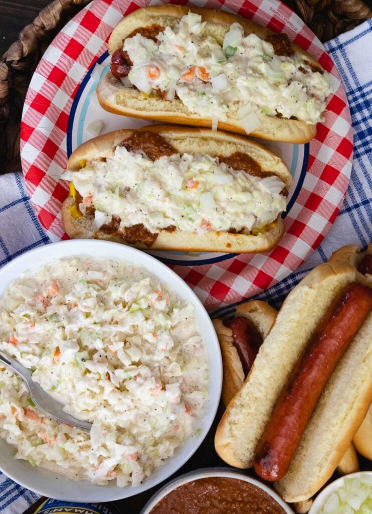 Creamy Coleslaw served with hot dogs is a match made in heaven. It's the perfect side dish for any cookout, and perfect for summer parties.