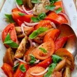 Fresh tomato Salad with basil and red onion is one of summers best side dished served with anything off the grill or just on it's own.
