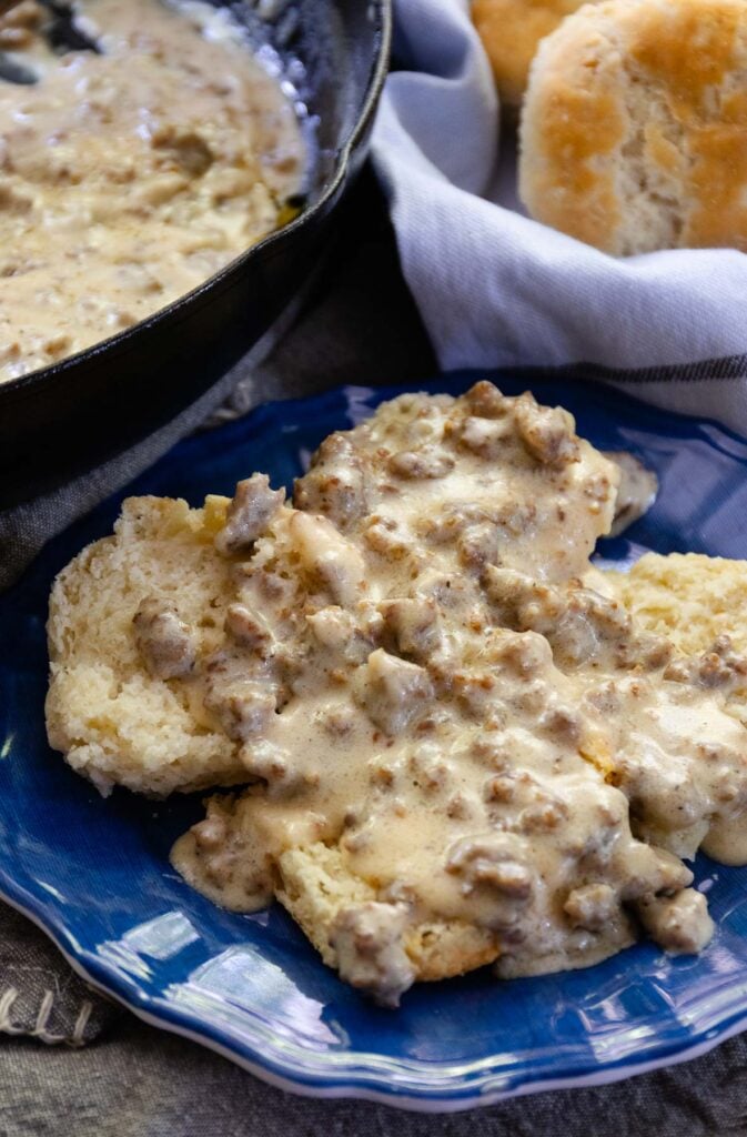 Homemade Sausage Gravy ladled over warm biscuits is a classic Southern recipe that's the ultimate comfort food for breakfast. This simple, delicious dish, made with just 3 ingredients in 20 minutes, is a great way to start the day and is delicious for dinner, too!