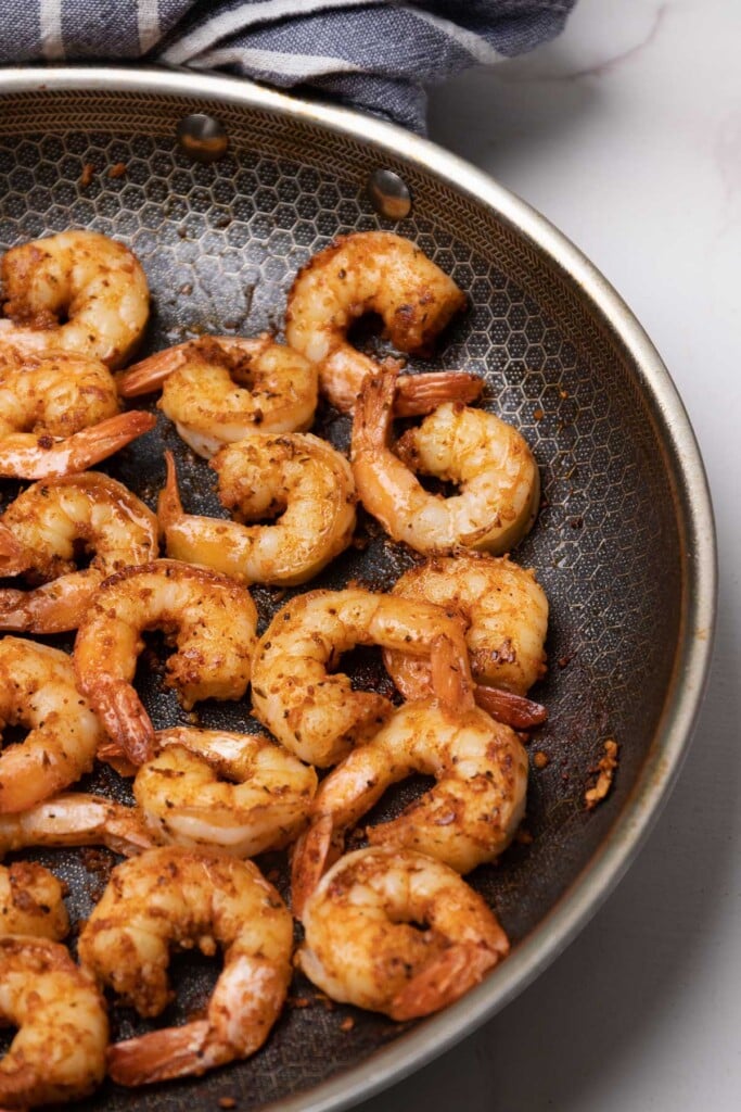 Cajun garlic shrimp perfected cooked in a non-stick pan served as an appetizer or as a main dish.