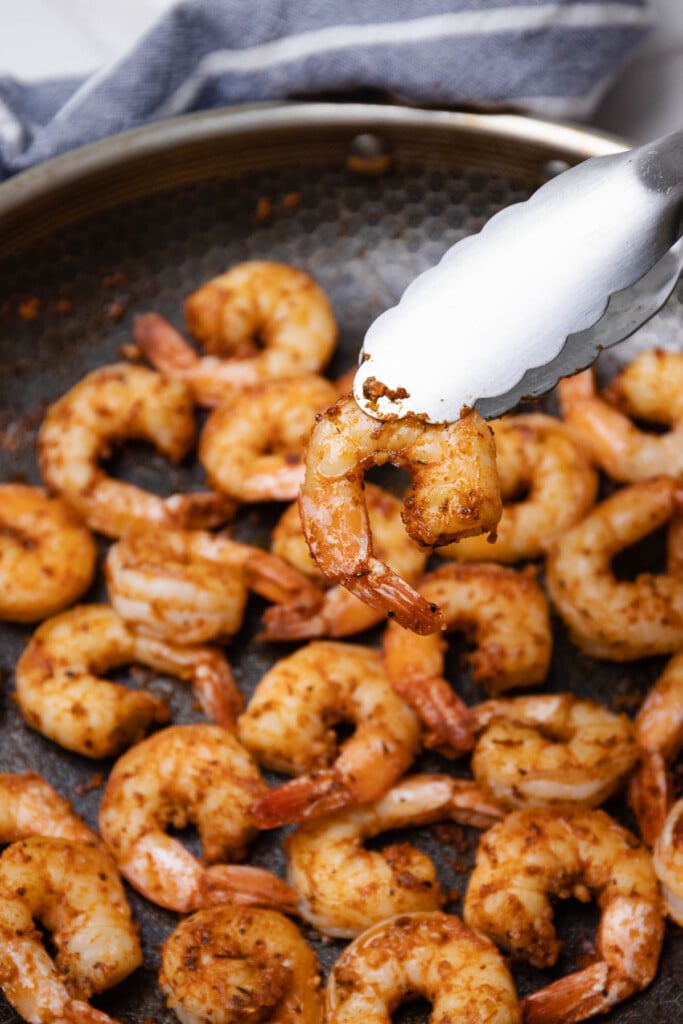 Cajun garlic shrimp perfected cooked in a non-stick pan served as an appetizer or as a main dish.