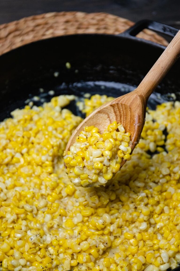 Southern Fried Corn made in a cast iron skillet with butter, a little bacon grease, salt and pepper.