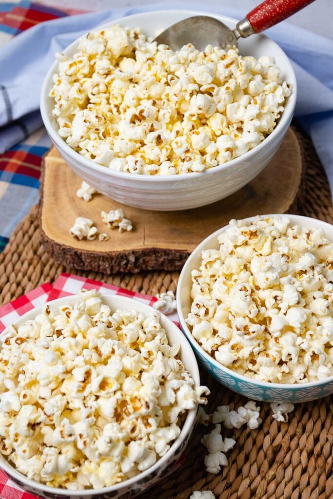 3 bowls of delicious homemade stovetop popcorn.Drizzled with melted butter and seasoned to perfection with salt.