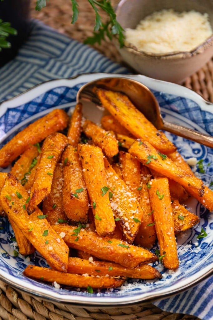 Air Fryer Carrots seasoned with garlic powder, salt, pepper and parmesan cheese are simple to make and are a perfect side dish.