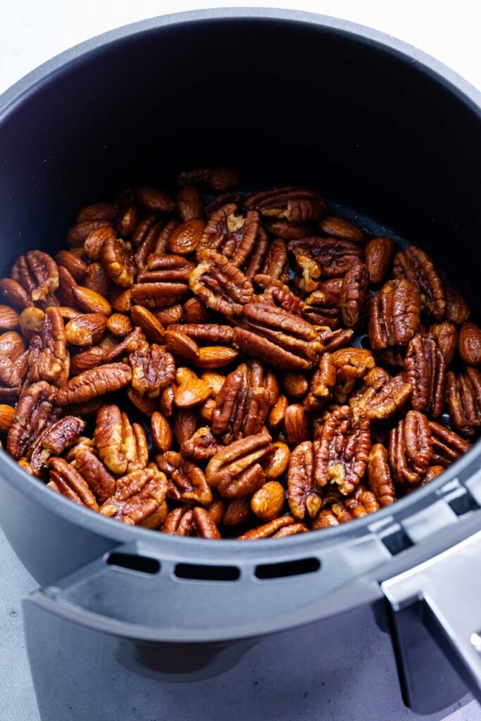 Pecans and almonds roasted in the air fryer flavored with butter, honey and cayenne pepper.