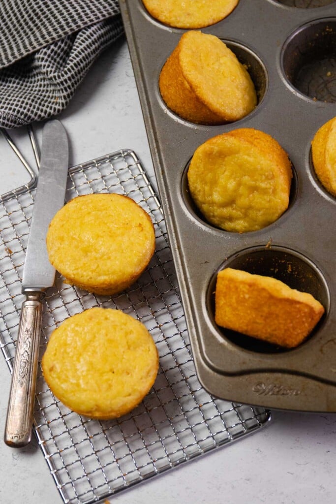 Baked corn muffins made with creamed corn and Jiffy mix baked in a muffin tin.