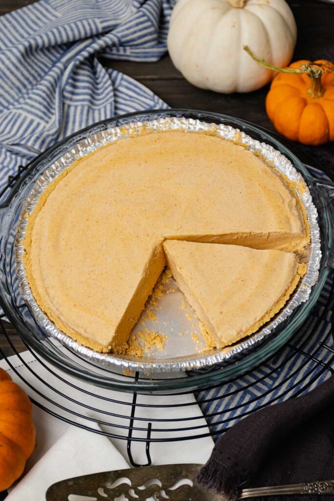 Sliced Creamy Pumpkin Icebox Pie with graham cracker crust.