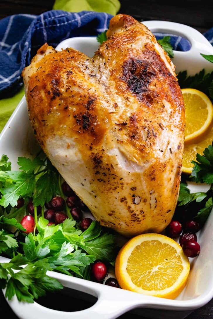 Whole turkey breast cooked in the crock pot is tender and juicy, then broil for a crispy skin that's perfect for any holiday.