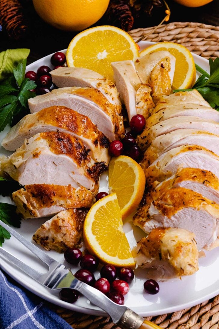 Juicy, tender turkey breast cooked in the crock pot, sliced and ready to serve for Thanksgiving.