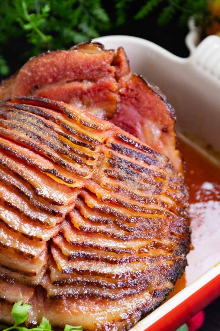 Spiral cut Copycat Honey Baked Ham served for Thanksgiving and Christmas has a sweet crunchy glaze and is easy to make.