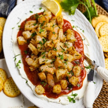 Layered Shrimp Dip with cream cheese and homemade cocktail sauce is a delicious, easy-make appetizer perfect for any party of spur of the moment gathering.