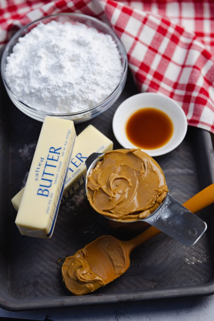 Homemade Peanut Butter Fudge made in the microwave with just 4 ingredients in about 10 minutes is smooth, buttery and full of amazing peanut butter flavor!
