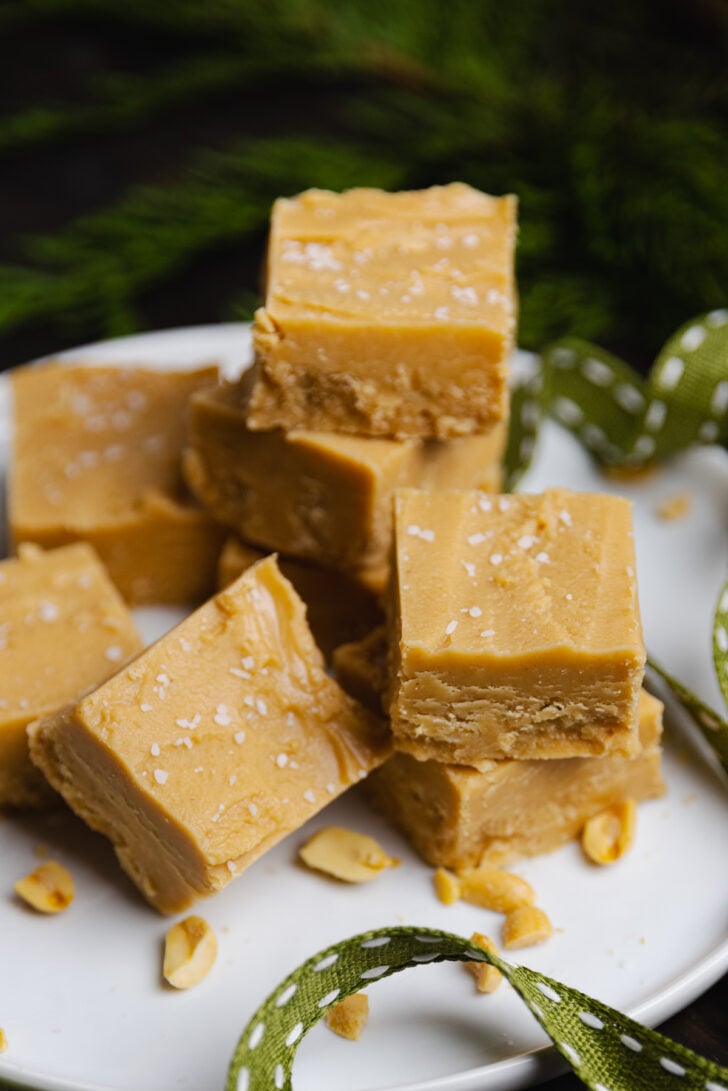 Homemade Peanut Butter Fudge made in the microwave with just 4 ingredients in about 10 minutes is smooth, buttery and full of amazing peanut butter flavor!