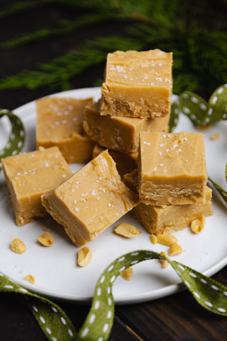 Homemade Peanut Butter Fudge made in the microwave with just 4 ingredients in about 10 minutes is smooth, buttery and full of amazing peanut butter flavor!