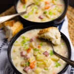 Crock Pot Ham And Potato Soup is full of vegetables and the perfect comfort food served with warm bread on a chilly night.