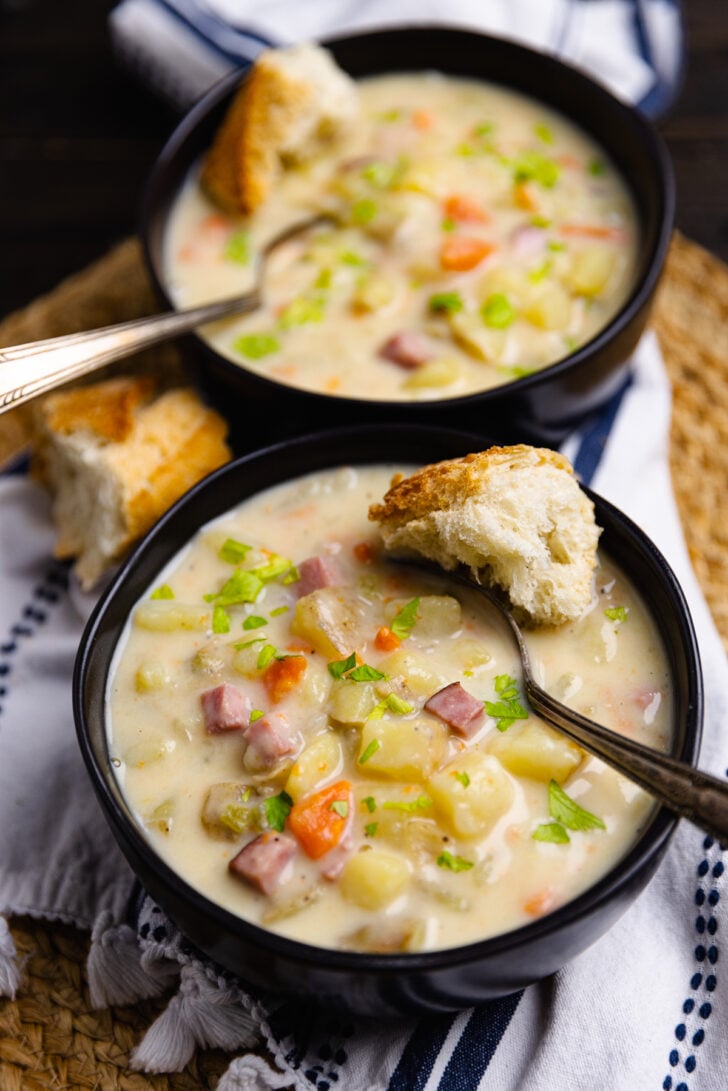 Crock Pot Ham And Potato Soup is full of vegetables and the perfect comfort food served with warm bread on a chilly night.