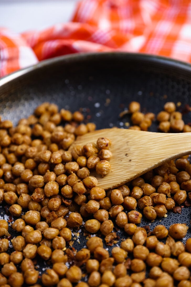 Skillet Roasted Chickpeas are easy to make, seasoned with salt and pepper and loaded with protein, making them a delicious snack or addition to soups and salads.