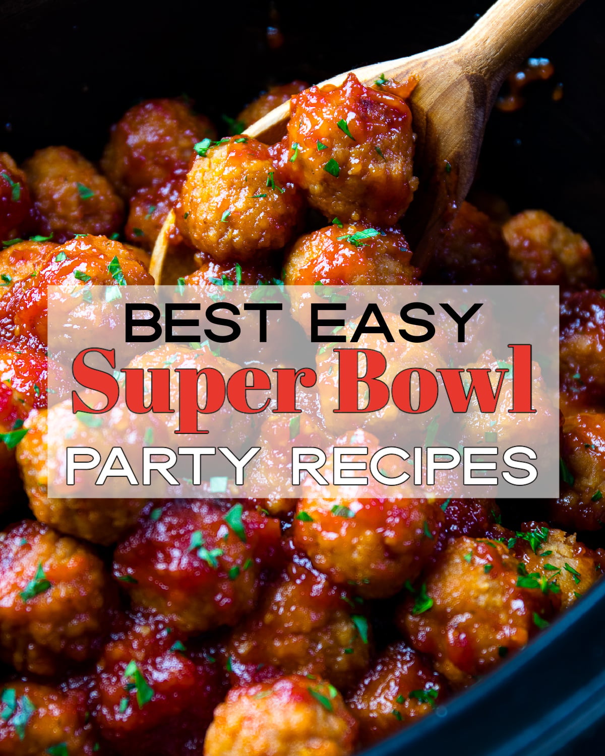 Glazed meatballs with green garnish in cast iron skillet, wooden spoon lifting one ball - Best Easy Super Bowl Party Recipes Pinterest pin