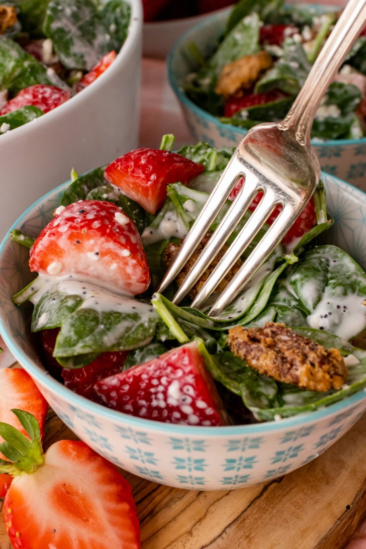 Spinach Strawberry Salad with a creamy homemade dressing is fresh, easy to make and perfect to serve any time of the year. Add candies pecans for a sweet crunch!