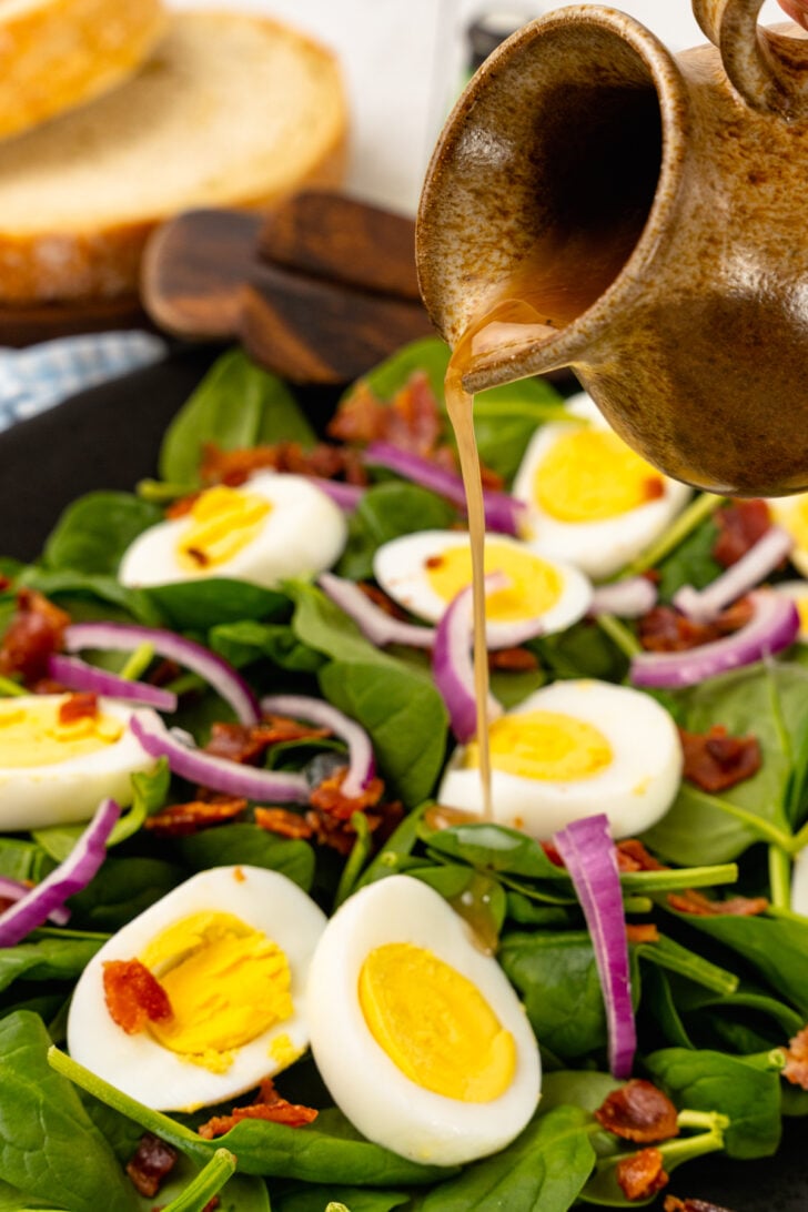 Fresh spinach, sliced red onion, crispy cooked bacon and boiled egg tossed in a warm bacon dressing tossed with wooden thongs.