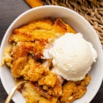Warm, sweet bread pudding is easy to make with slices of cinnamon raisin bread, eggs, spices and butter. It's baked and served with vanilla ice cream for a delicious dessert or for breakfast or brunch.