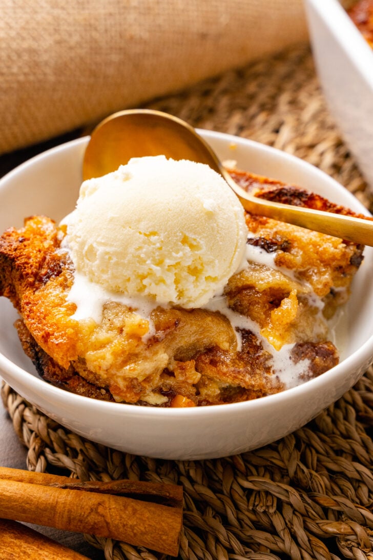 Warm, sweet bread pudding is easy to make with slices of cinnamon raisin bread, eggs, spices and butter. The inside is rich and soft with crispy edges on the outside.