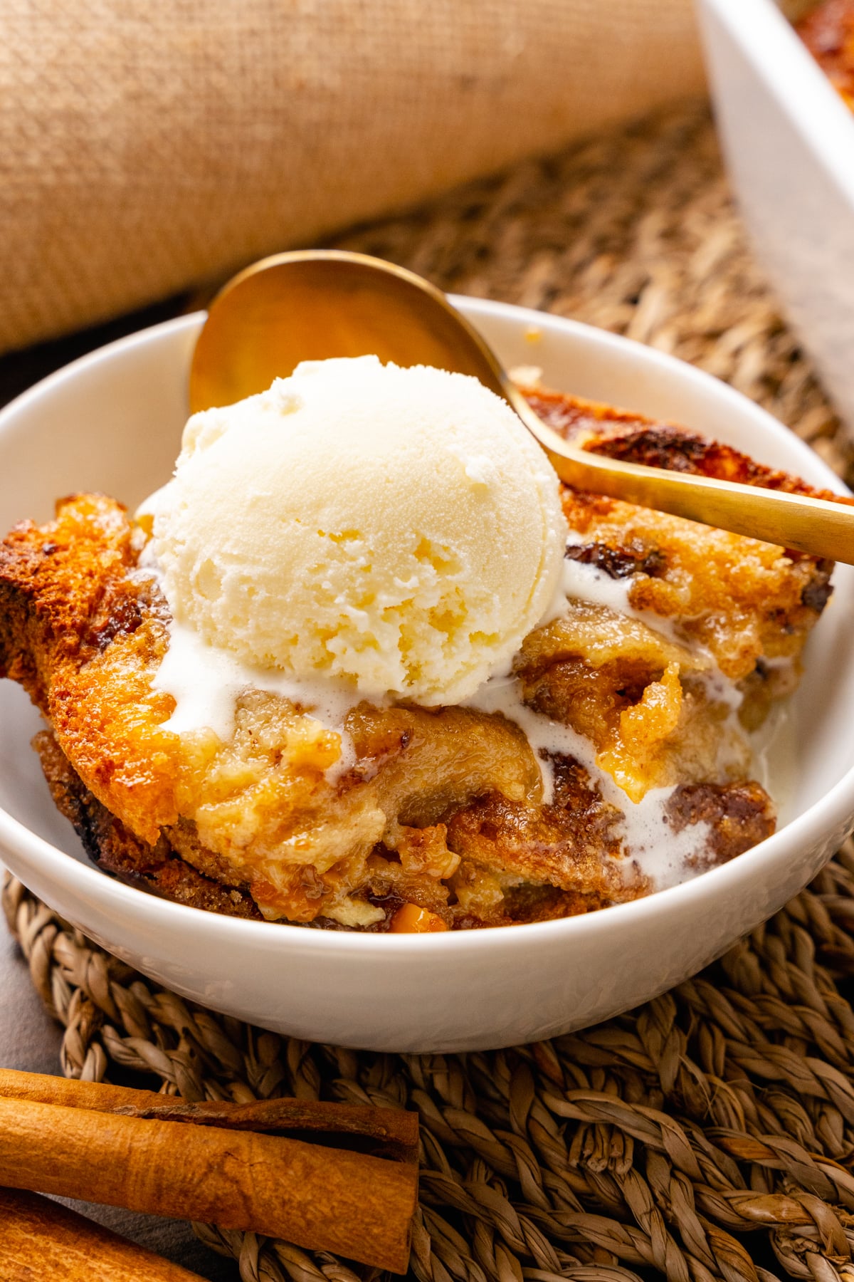 Warm, sweet bread pudding is easy to make with slices of cinnamon raisin bread, eggs, spices and butter. The inside is rich and soft with crispy edges on the outside.