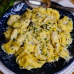 Creamy Cheesy Tortellini made on the stovetop is full of garlic, and herbs with a macaroni and cheese vibe making it a wonderful side dish!
