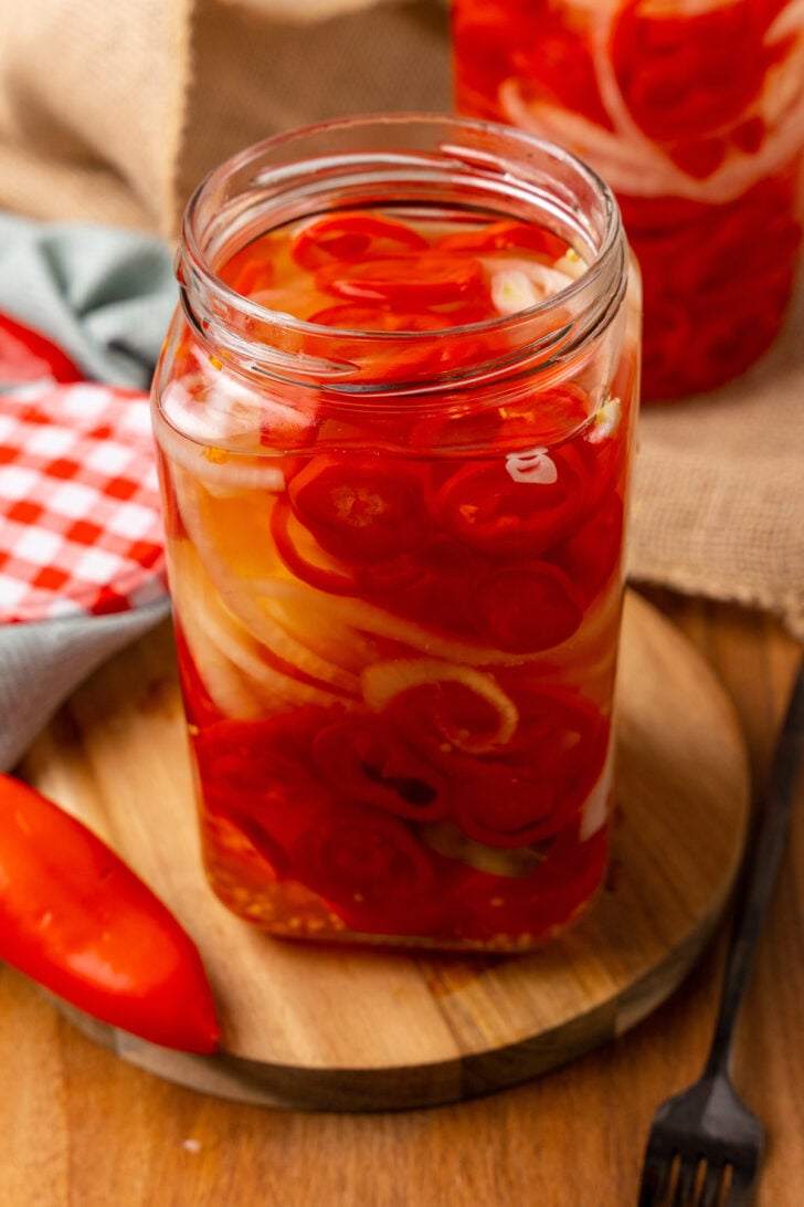 Quick Pickled Sweet Red Pepper And Onions are easy to make without in a salty brine the trouble of traditional canning and are great on burgers, hot dogs, sandwiches and tacos!