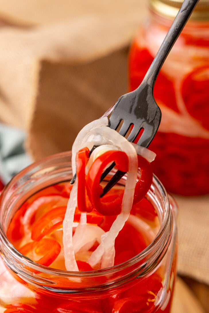 Quick Pickled Sweet Red Pepper And Onions are easy to make without the trouble of traditional canning and are great on burgers, hot dogs, sandwiches and tacos!