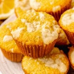 Lemon Poppy Seed Muffins with a sweet topping baked in cupcake papers are the perfect easy to make treat for breakfast, brunch or a grab and go treat.