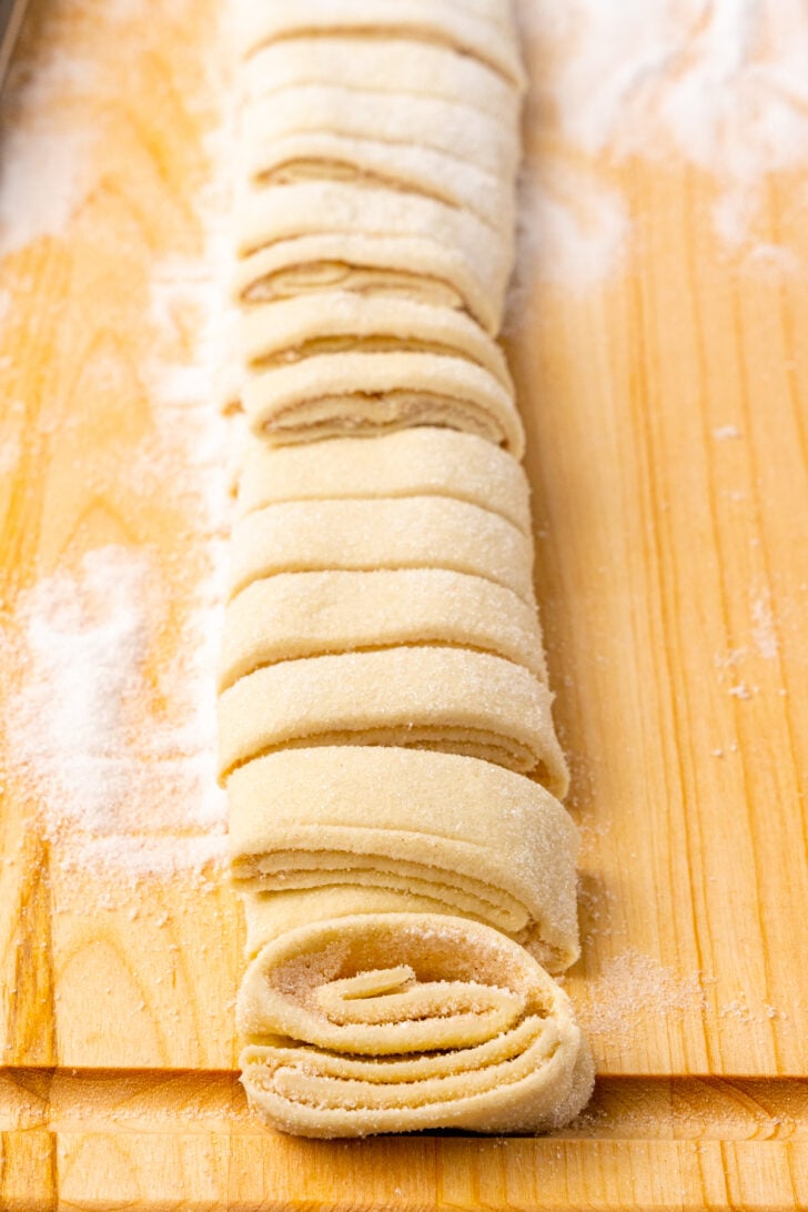 Puffed pastry with sugar and cinnamon but into slices to make Palmiers.