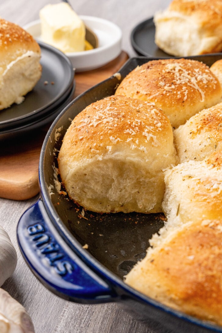 Dinner rolls made with garlic, butter and Parmesan cheese made from store bought rolls made in a cast iron skillet.