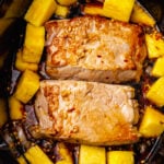 Crock Pot Pineapple Pork Roast cooked low and slow in a rich garlic, red pepper sauce is easy to make for dinner.