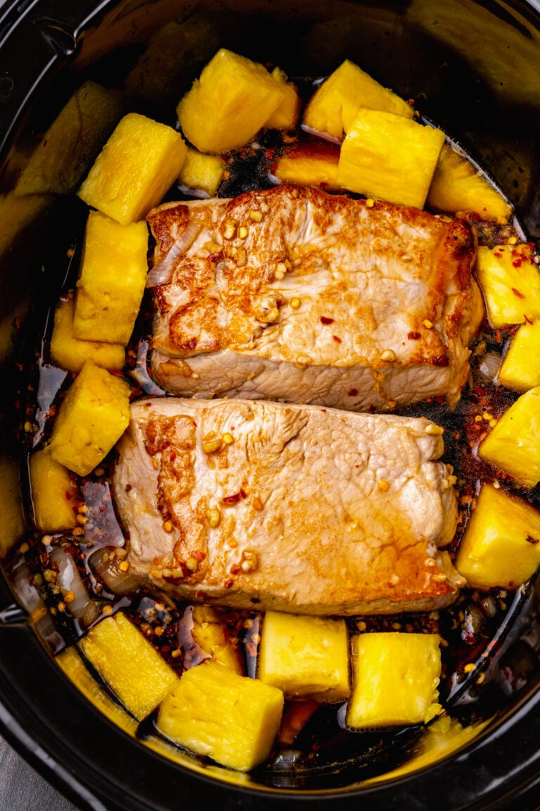 Crock Pot Pineapple Pork Roast cooked low and slow in a rich garlic, red pepper sauce is easy to make for dinner.