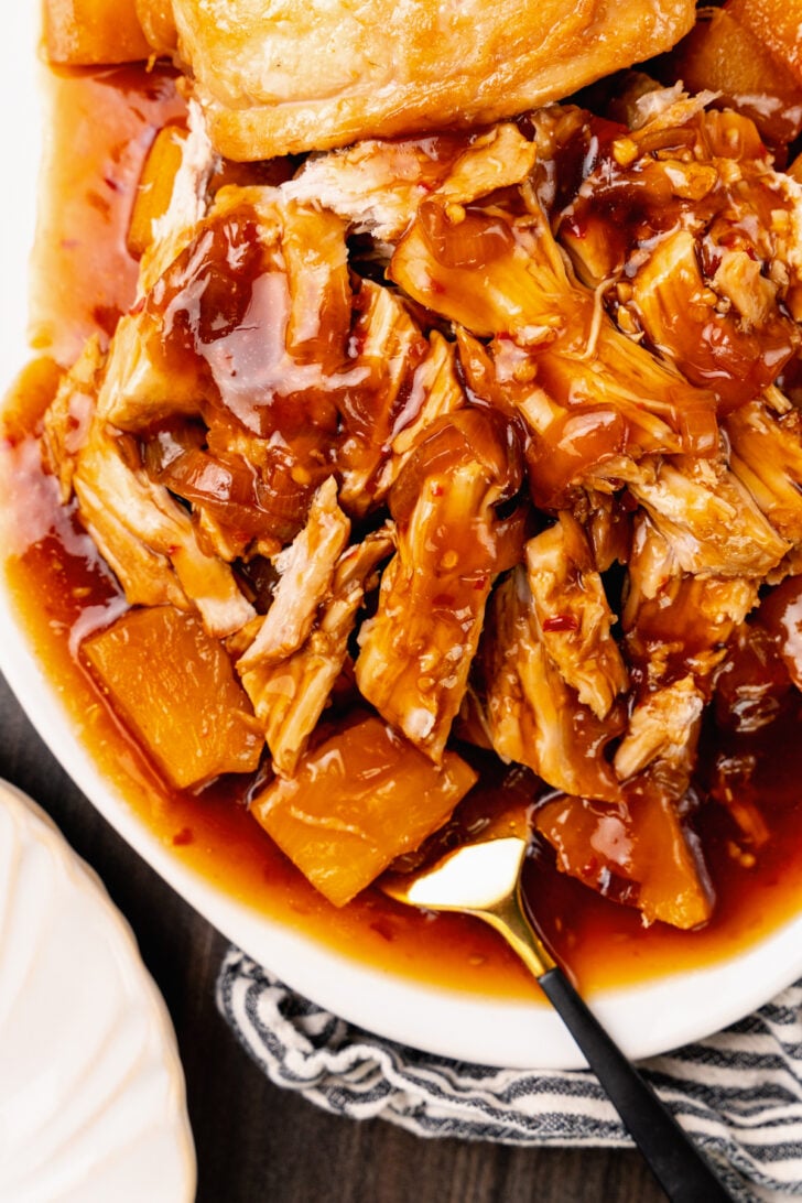 Crock Pot Pineapple Pork Loin cooked low and slow with onions in a rich, savory broth, served with rice and broccoli for an outstanding family dinner.