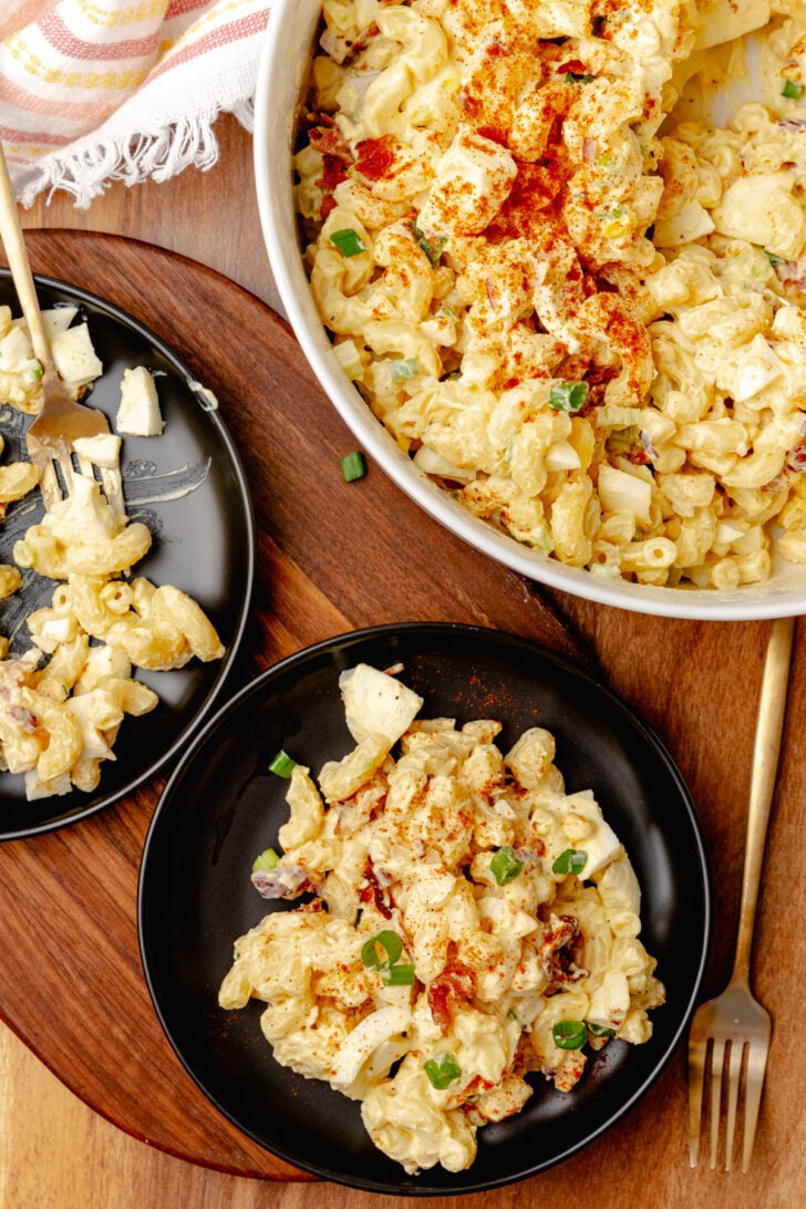 Creamy and full of flavor, Deviled Egg Pasta Salad is a side dish classic that perfect for any family gathering, cookout, or potluck. Made with elbow macaroni, boiled eggs, celery, bacon and topped with green onions all in a delicious mayonnaise based dressing.