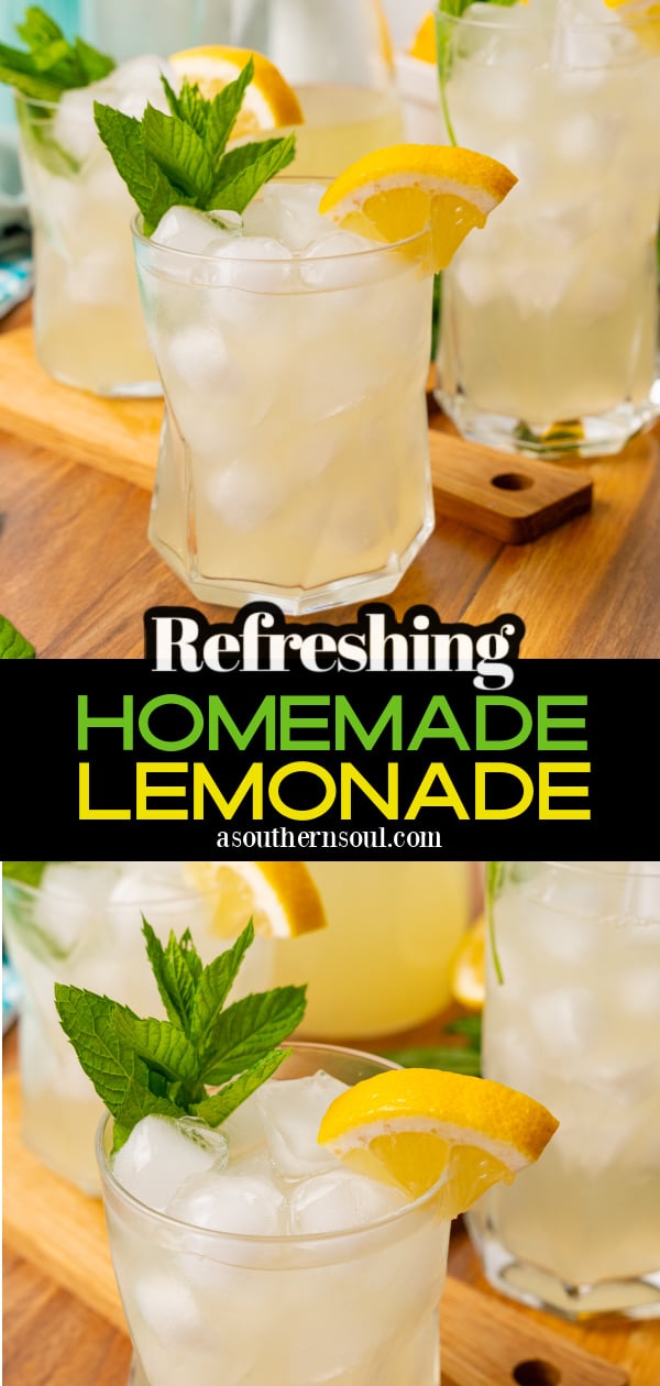 Glass of homemade lemonade with a lemon wedge and sprig of mint on a wooden board.