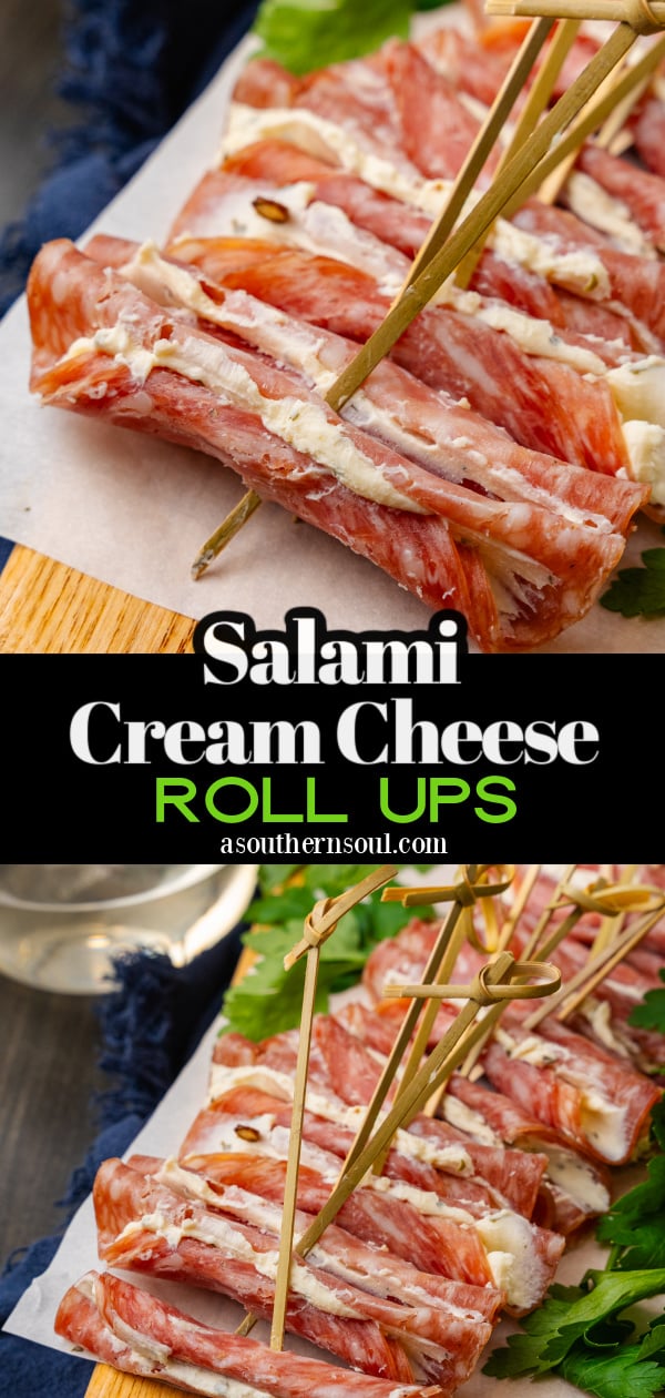 Wooden cutting board with cream cheese filled salami slices with a wooden pick.