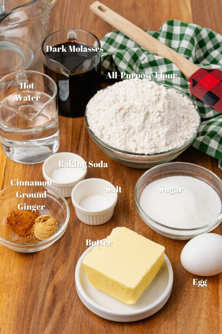 Dark molasses, all purpose flour, water, sugar, egg, butter, salt, baking soda, cinnamon and ground ginger in glass containers.